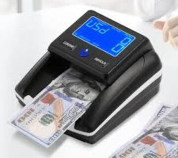 فحص الدولار المزور